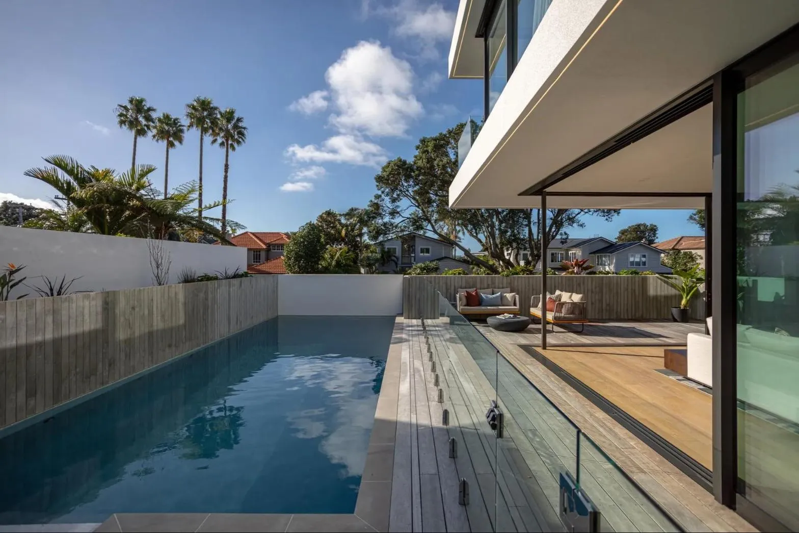 Lap pool beside a covered timber terrace